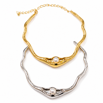 18K gold plated sculptural wave choker necklace with a luminous faux pearl centerpiece displayed on a clean white background.