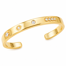 18K gold plated open cuff bracelet featuring engraved celestial motifs and sparkling bezel-set cubic zirconia on a clean white background.