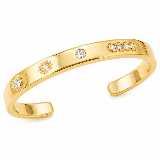 18K gold plated open cuff bracelet featuring engraved celestial motifs and sparkling bezel-set cubic zirconia on a clean white background.